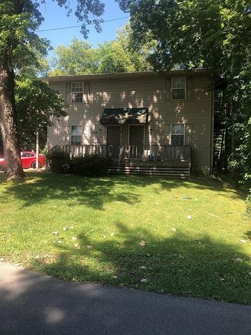 Bowling Green apartment for rent - A house with a red car parked in front.