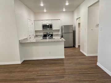 Killeen apartment for rent - a kitchen with a counter top and a refrigerator