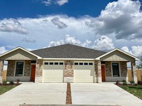 Killeen apartment for rent - a house with a garage and a cloudy sky