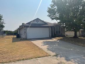 Killeen house for rent - a house with a driveway and a garage door