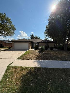 Killeen house for rent - a house with a driveway and a garage door