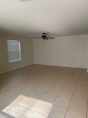 Killeen apartment for rent - an empty living room with a ceiling fan
