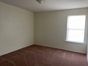 Killeen apartment for rent - an empty room with a window and a tiled floor