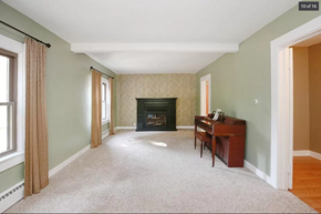 Comstock Park house for rent - a living room with a piano and a fireplace