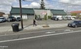 Tacoma apartment for rent - a person walking on a sidewalk next to a street