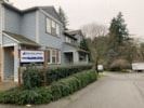 Gig Harbor apartment for rent - a blue house with a sign in front of it
