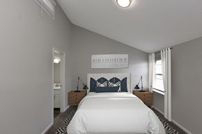 Memphis apartment for rent - a bedroom with a large white bed and a window