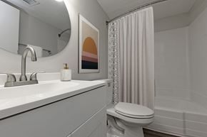 Memphis apartment for rent - a bathroom with a sink and a toilet and a shower