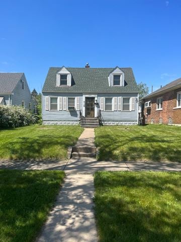 Gary house for rent - a blue house with a sidewalk in front of it