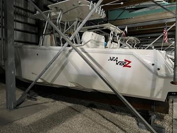 Naples house for rent - a white boat parked in a garage