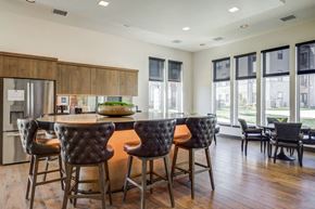 Denver apartment for rent - A kitchen with a table and chairs in front of a window.