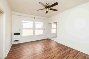 Los Angeles apartment for rent - A room with a ceiling fan and wooden flooring.