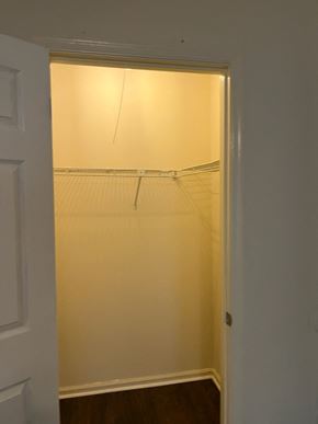 Newnan house for rent - a closet with a white door and a light in it