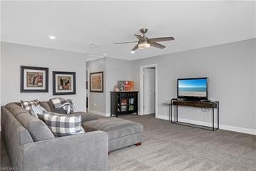 Estero house for rent - a living room with a couch and a tv