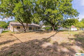 Killeen house for rent - a house with a yard and trees in front of it