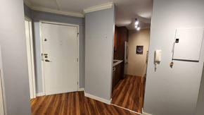Richmond apartment for rent - a room with wood floors and a white door