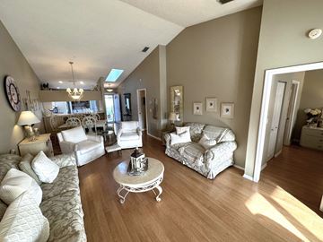 Bradenton house for rent - a living room with couches and a table