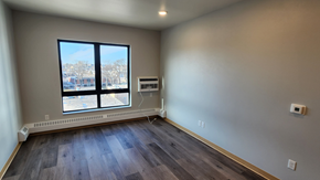 Fargo apartment for rent - a living room with wood floors and a large window