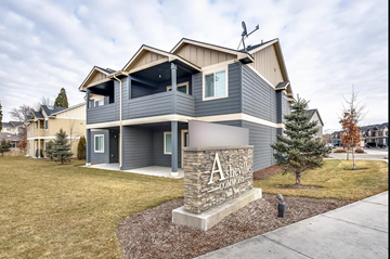 Boise apartment for rent - the front of a house with a stone sign in front of it