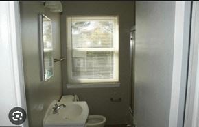 Severn house for rent - a bathroom with a sink and a toilet and a window