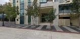 San Diego apartment for rent - a large building with trees in front of it