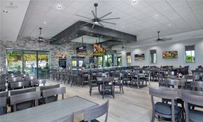 Estero house for rent - the dining area of a restaurant with tables and chairs
