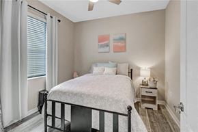 Estero house for rent - a bedroom with a bed and a window