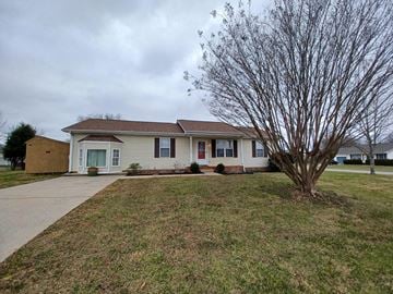Clarksville house for rent - a white house with a tree in front of it