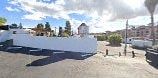 Vista apartment for rent - a large white building in the middle of a parking lot