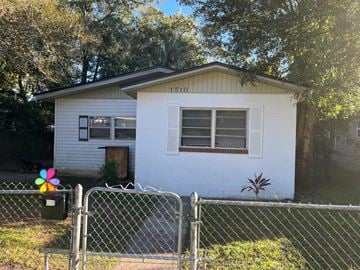 Jacksonville house for rent - a small white house with a fence in front of it