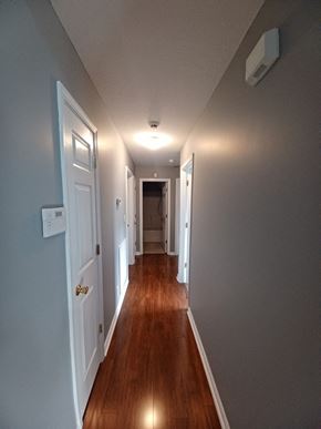 Clarksville house for rent - A long hallway with a light at the end.