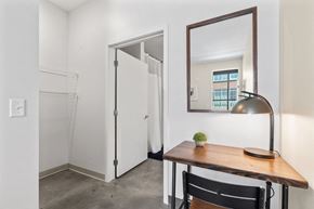 Minneapolis apartment for rent - a room with a desk and a mirror and a closet
