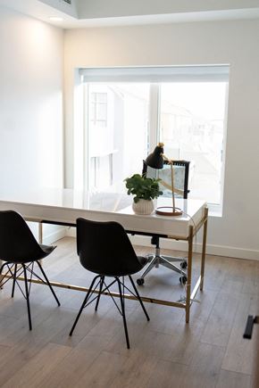 Winnipeg apartment for rent - a dining room with a table and chairs and a window