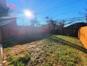 Killeen house for rent - a backyard with a fence and a yard with grass