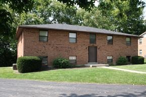 Lebanon apartment for rent - A brick house with a brown door and windows.