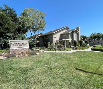 Santa Barbara apartment for rent - a lawn in front of a house with a sign
