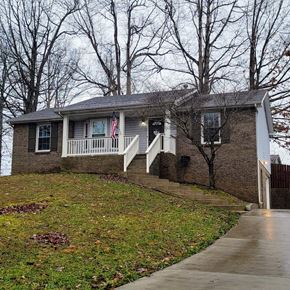 Clarksville house for rent - A house with a flag on the porch.