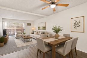 Cypress apartment for rent - A dining room with a wooden table and chairs.
