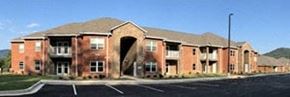 Blairsville apartment for rent - a large brick building with an arch in the front