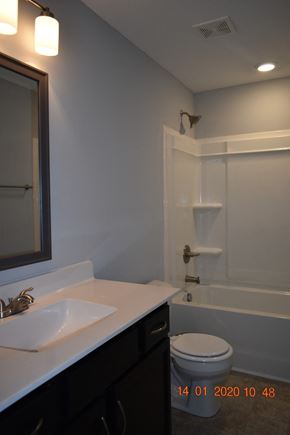 Clarksville house for rent - A white sink in a bathroom with a toilet and a bathtub.