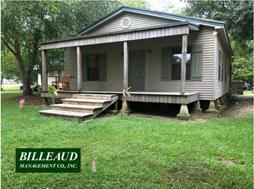 Lafayette house for rent - A house with a porch and a green lawn in front.