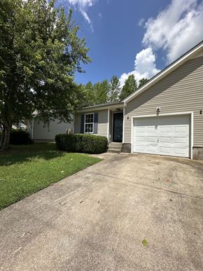 Clarksville house for rent - a white garage door on the side of a house