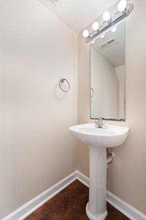 Jacksonville house for rent - a small bathroom with a sink and a mirror