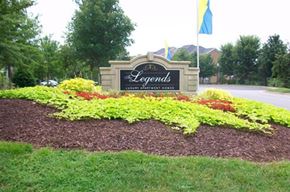Hickory apartment for rent - a garden of flowers in front of a sign
