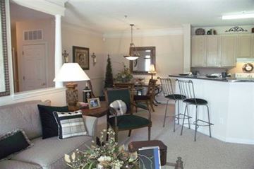 Hickory apartment for rent - a living room and kitchen with a couch and chairs