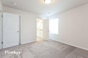 Greenville house for rent - a bedroom with two closets and a door to a bathroom
