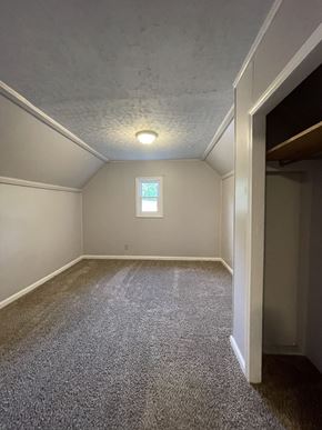 Clarksville house for rent - A small room with a window and carpeted floor.