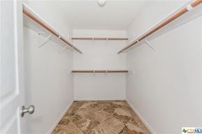 Copperas Cove house for rent - a walk in closet with white walls and shelves