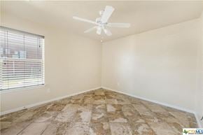 Copperas Cove house for rent - an empty room with a ceiling fan and a window
