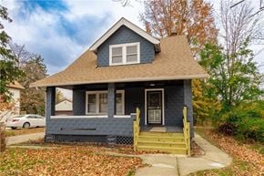 Maple Heights house for rent - a blue house with a brown roof and a porch